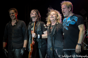 Kelly Keagy, Keri Kelli, Jack Blades and Brad Gillis of Night Ranger taking a bow at Old Shawnee Days in Shawnee, KS on June 3, 2017.