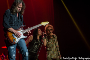 Guitarist John Roth with Stephanie Calvert and Mickeythomas of Starship performing live at Ameristar Casino in Kansas City, Missouri on June 10, 2017.