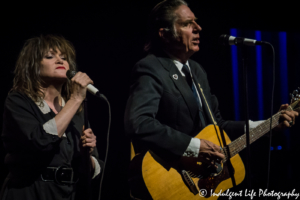 X band members John Doe and Exene Cervenka performing live at Kauffman Center for the Performing Arts in Kansas City, MO on July 18, 2017.