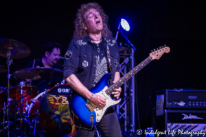 Frontman Dave Meniketti of hard rock band Y&T in guitar solo live in concert at VooDoo Lounge inside Harrah's North Kansas City Hotel & Casino on March 8, 2018.