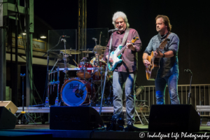 Frontman Larry Stewart with guitarist Greg Jennings and drummer John Dittrich of Restless Heart performing live at Festival on the Trails in Gardner, KS on June 9, 2018.