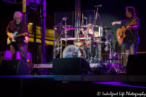 Frontman Larry Stewart with drummer John Dittrich and guitar player Greg Jennings of Restless Heart live in concert at Festival on the Trails in Gardner, KS on June 9, 2018.
