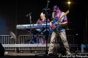 Restless Heart bass guitar player Paul Gregg performing live with keyboardist Dave Innis at Festival on the Trails in Gardner, KS on June 9, 2018.
