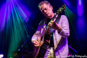 Michael Bacon playing the acoustic guitar at the Voodoo Lounge concert venue inside of Harrah's North Kansas City Hotel & Casino on July 14, 2018.