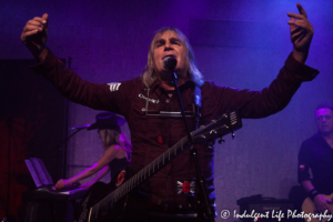 The Alarm lead singer Mike Peters performing with wife Jules Peters on keyboards and guitarist James Stevenson at recordBar in Kansas City, MO on November 7, 2018.