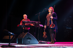 Violin player Janet Jameson and keyboardist Dennis Laffoon of Shooting Star performing together at Ameristar Casino in Kansas City, MO on January 19, 2019.