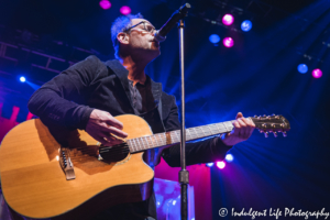 Frontman Robin Wilson of the Gin Blossoms playing the acoustic guitar live at Star Pavilion inside of Ameristar Casino Hotel Kansas City on January 25, 2018.