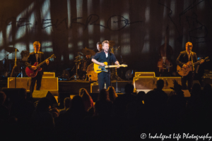 John Mellencamp playing with band members Mike Wanchic and Andy Clark on guitars plus Andy Clark on drums at the Midland Theatre in downtown Kansas City, MO on March 14, 2019.