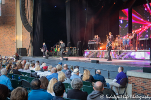 Robert Lamm of Chicago performing live on the keytar in front of a couple of a couple female fanatics at Starlight Theatre in Kansas City, MO on May 19, 2019.