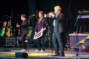 Trumpet player Lee Loughnane of Chicago performing live with Robert Lamm and Keith Howland at Kansas City's Starlight Theatre on May 19, 2019.