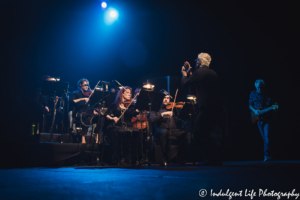 Little River Band keyboard player Chris Marion conducting the live orchestra with the band at Ameristar Casino in Kansas City, MO on May 3, 2019.