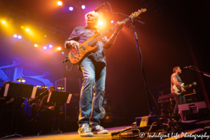 Lead singer and bass player Wayne Nelson and guitarist Colin Whinnery of Little River Band performing with a live orchestra at Star Pavilion inside of Ameristar Casino in Kansas City, MO on May 3, 2019.