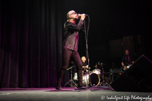 Men Without Hats lead vocalist Ivan Doroschuk performing with drummer Adrian White and guitarist Sho Murray at Ameristar Casino in Kansas City, MO on June 22, 2019.