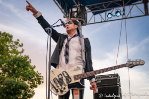 A Flock of Seagulls bass guitarist Pando hyping the crowd at Town Center Plaza's Sunset Music Fest in Leawood, KS on June 27, 2019.