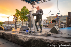 A Flock of Seagulls members Mike Score on the keyboard, Kevin Rankin on drums and Pando on bass guitar at Sunset Music Fest in Leawood, KS on June 27, 2019.