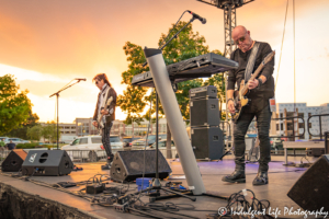 A Flock of Seagulls frontman Mike Score and bass guitarist Pando live in concert at Sunset Music Fest on the Town Center Plaza in Leawood, KS on June 27, 2019.