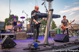 A Flock of Seagulls members Mike Score and Gord Deppe on guitar and Kevin Rankin on drums at Sunset Music Fest in Leawood, KS on June 27, 2019.