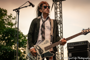 A Flock of Seagulls bass guitar player Pando live in concert at Town Center Plaza's Sunset Music Fest in Leawood, KS on June 27, 2019.