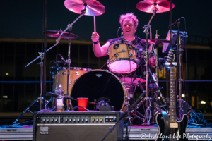 A Flock of Seagulls drummer Kevin Rankin in a live festival performance at Town Center Plaza's Sunset Music Fest in Leawood, KS on June 27, 2019.