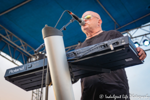 A Flock of Seagulls lead vocalist and keyboard player Mike Score live on stage at Town Center Plaza's Sunset Music Fest in Leawood, KS on June 27, 2019.