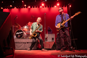 Bass guitarist Tim Butler, saxophone player "Downtown" Michael Brown and drummer Ty Cox of Sha Na Na performing at Ameristar Casino's Star Pavilion in Kansas City, MO on June 21, 2019.