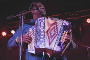 Squeeze box player Chubby Carrier live in concert inside of the Garage at Knuckleheads Saloon in Kansas City, MO on March 2021.