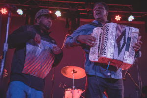 Accordion player Chubby Carrier and his bandmate on the frottoir performing at Knuckleheads Saloon in Kansas City, MO on March 13, 2021.