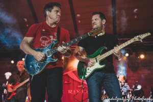 Little River Band guitarists Rich Herring and Colin Whinnery performing live together at Riverside Park Amphitheater in Jefferson City, MO on June 4, 2021.