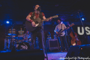 Steve Earle performing with drummer Brad Pemberton and bassist Jeff Hill at Knuckleheads Saloon in Kansas City, MO on July 9, 2021
