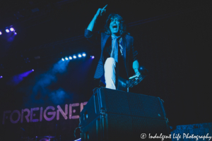 Lead vocalist Kelly Hansen of Foreigner singing and playing the tambourine live at Hartman Arena in Park City, KS on August 7, 2021.