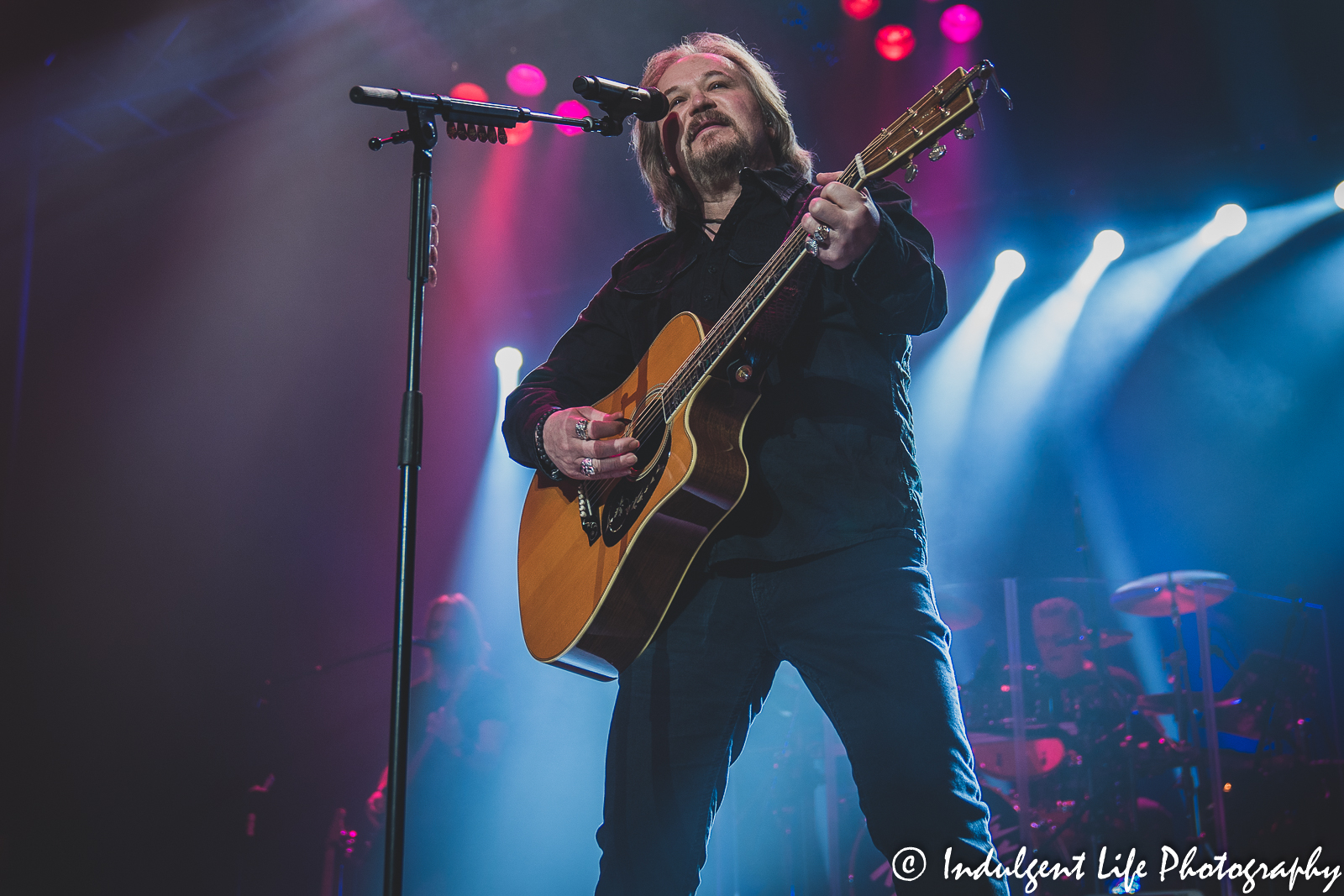 Travis Tritt playing the acoustic guitar during his live concert at Ameristar Casino's Star Pavilion in Kansas City, MO on December 3, 2021.