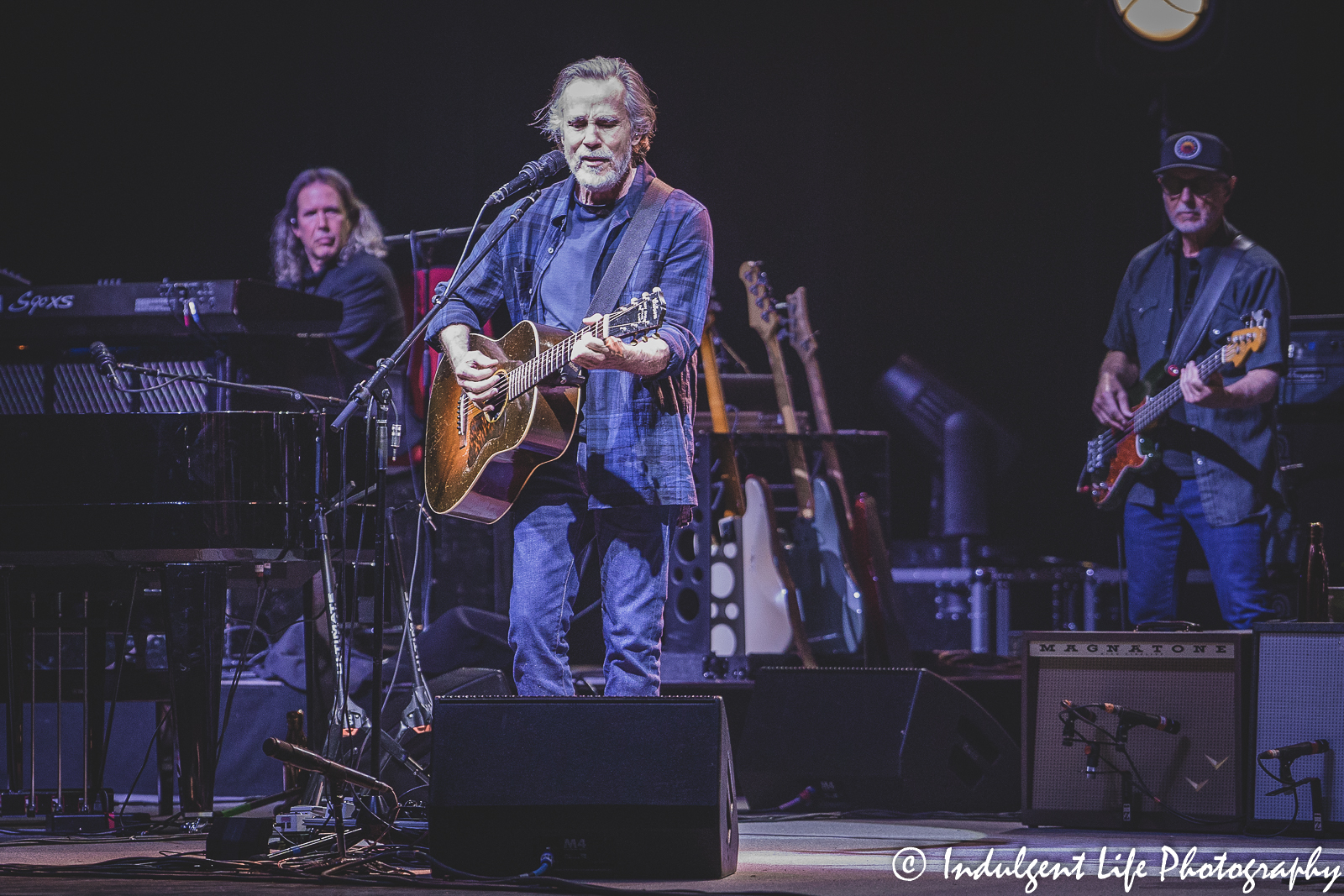 Jackson Browne performing live with keyboardist Jason Crosby and bass player Bob Glaub at Kansas City Music Hall on June 7, 2022.