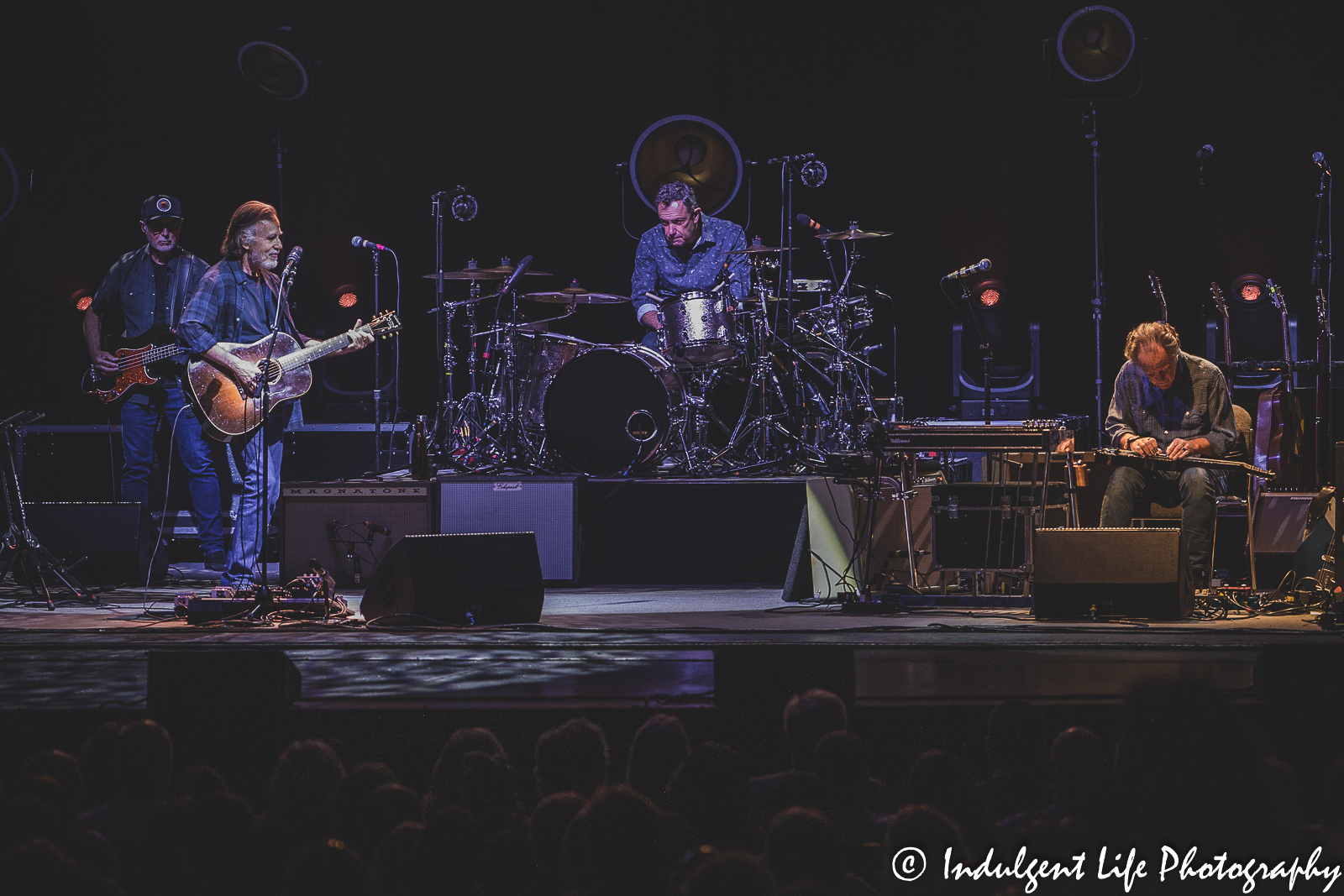 Jackson Browne performing live with bass player Bob Glaub, drummer Mauricio Lewak and steel lap guitarist Greg Leisz at Kansas City Music Hall on June 7, 2022.
