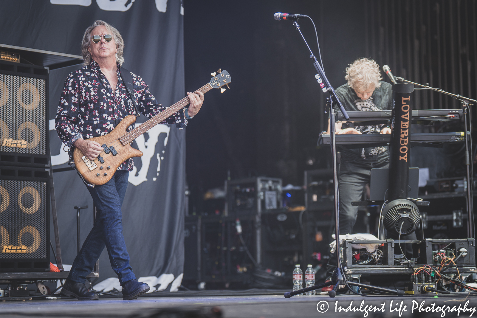 Loverboy bass guitarist Ken "Spider" Sinnaeve and keyboard player Doug Johnson performing together at Starlight Theatre in Kansas City, MO on June 14, 2022.