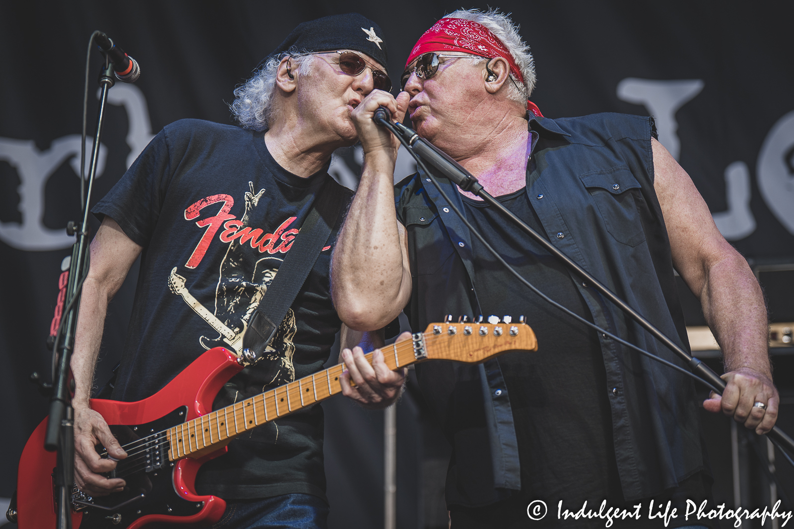Loverboy guitar player Paul Dean and frontman Mike Reno performing live together at Starlight Theatre in Kansas City, MO on June 14, 2022.