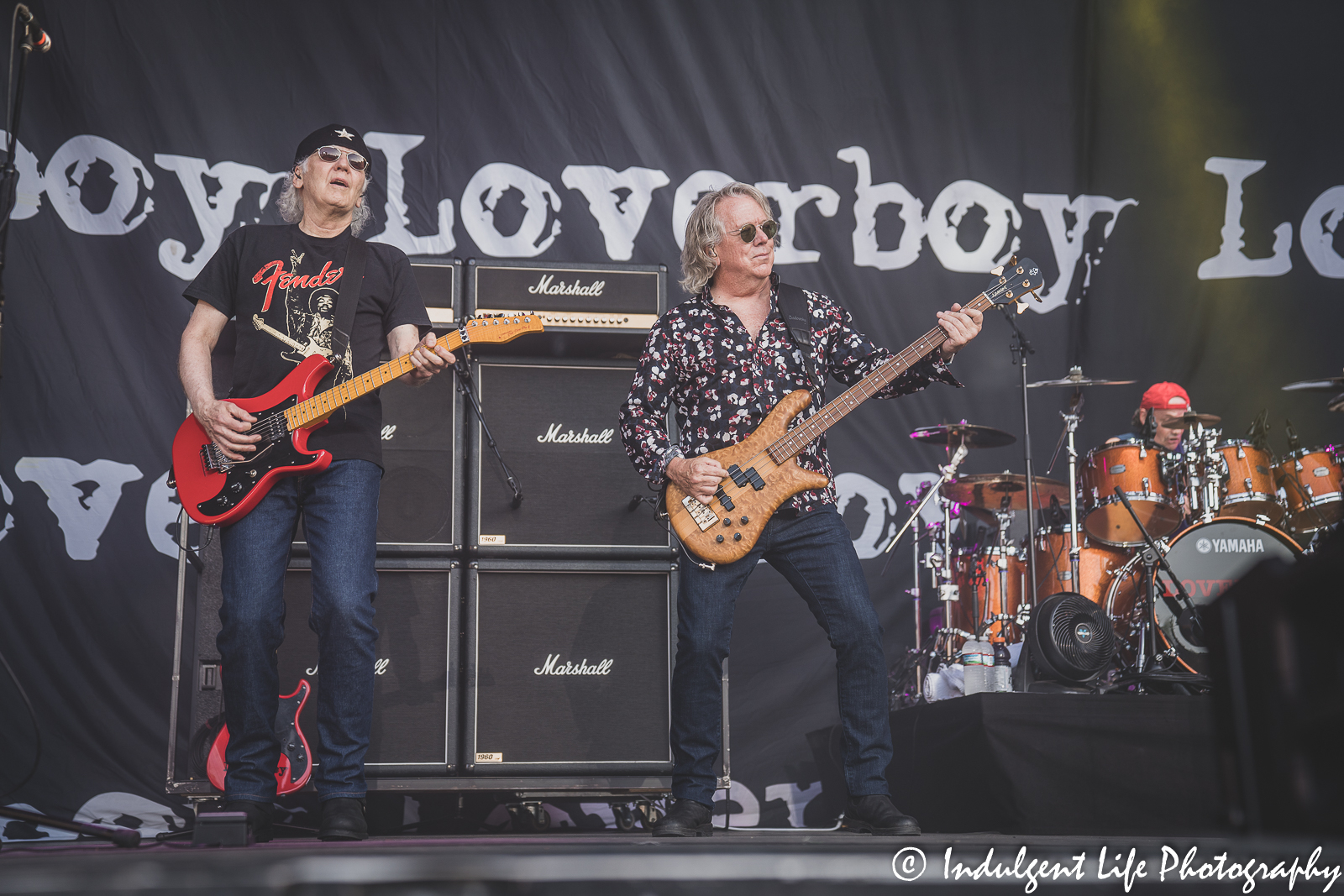 Loverboy band members Paul Dean, Ken "Spider" Sinnaeve and Matt Frenette performing together at Starlight Theatre in Kansas City, MO June 14, 2022.