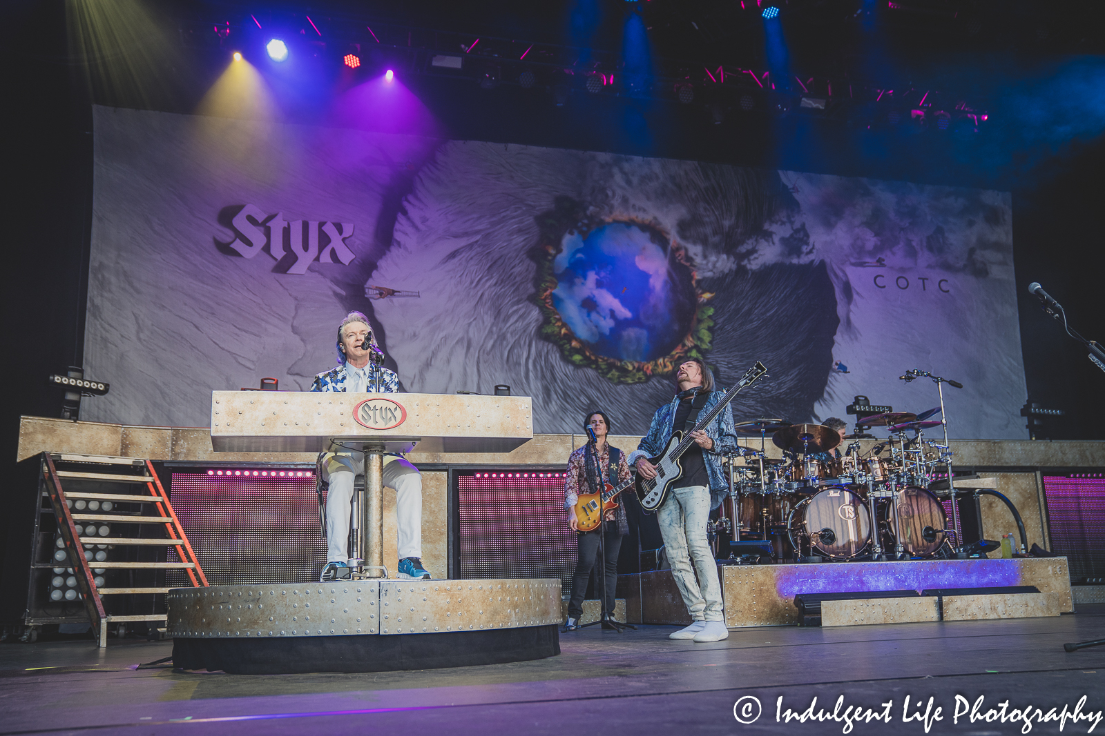 Styx band members Lawrence Gowan, Will Evankovich, Ricky Phillips and Todd Sucherman playing together at Starlight Theatre in Kansas City, June 14, 2022.