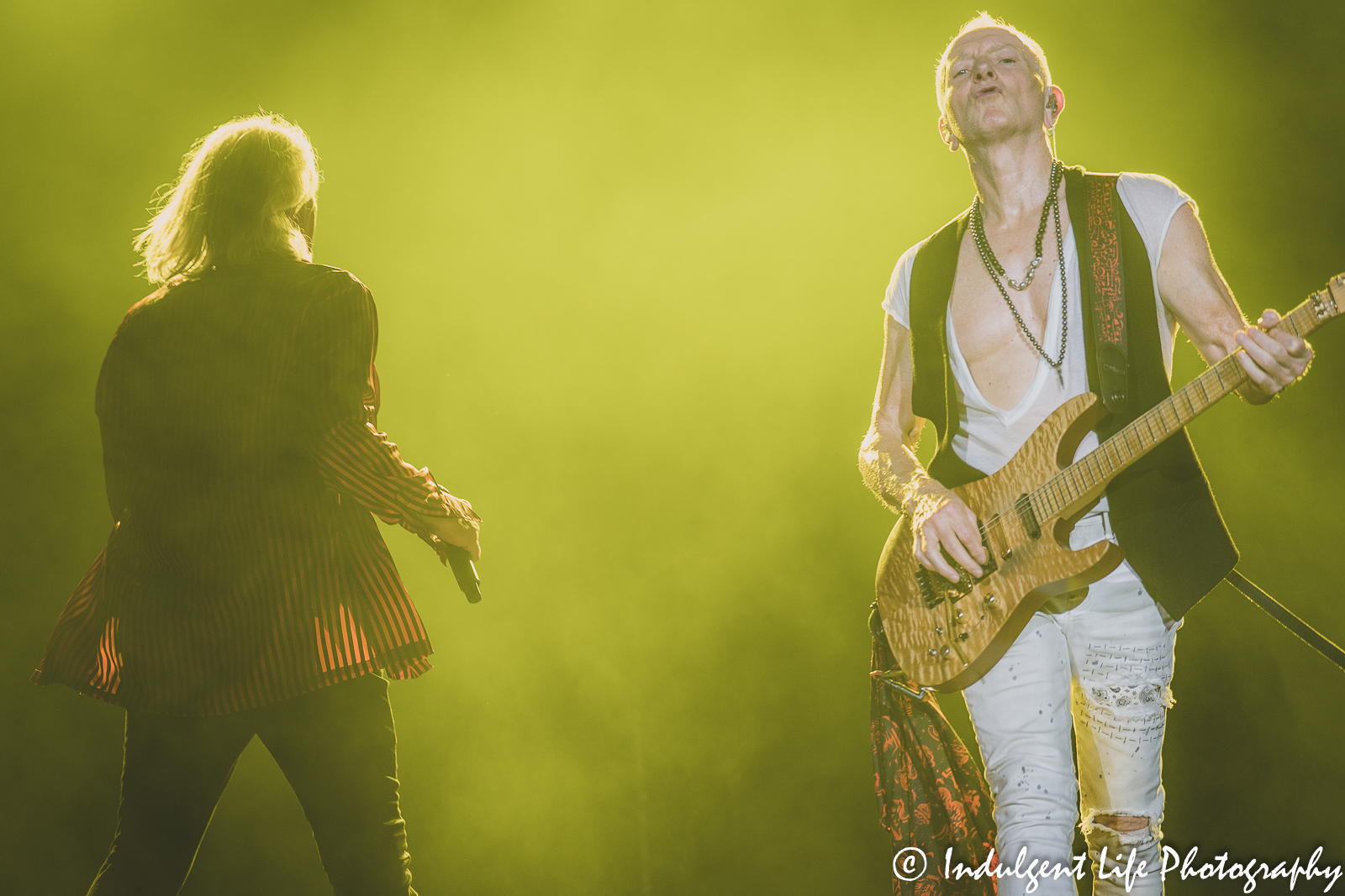 Guitarist Phil Collen of Def Leppard heading down the ramp during the band's concert at Kauffman Stadium in Kansas City, MO on July 19, 2022.
