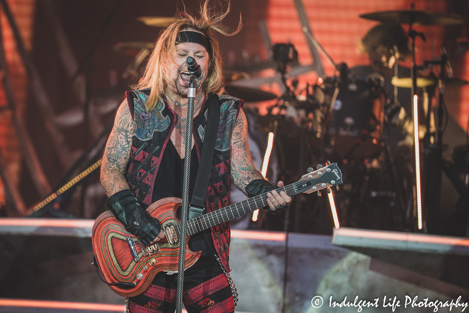 Lead singer Vince Neil singing live as he performs with drummer Tommy Lee at Kauffman Stadium in Kansas City, MO on July 19, 2022.