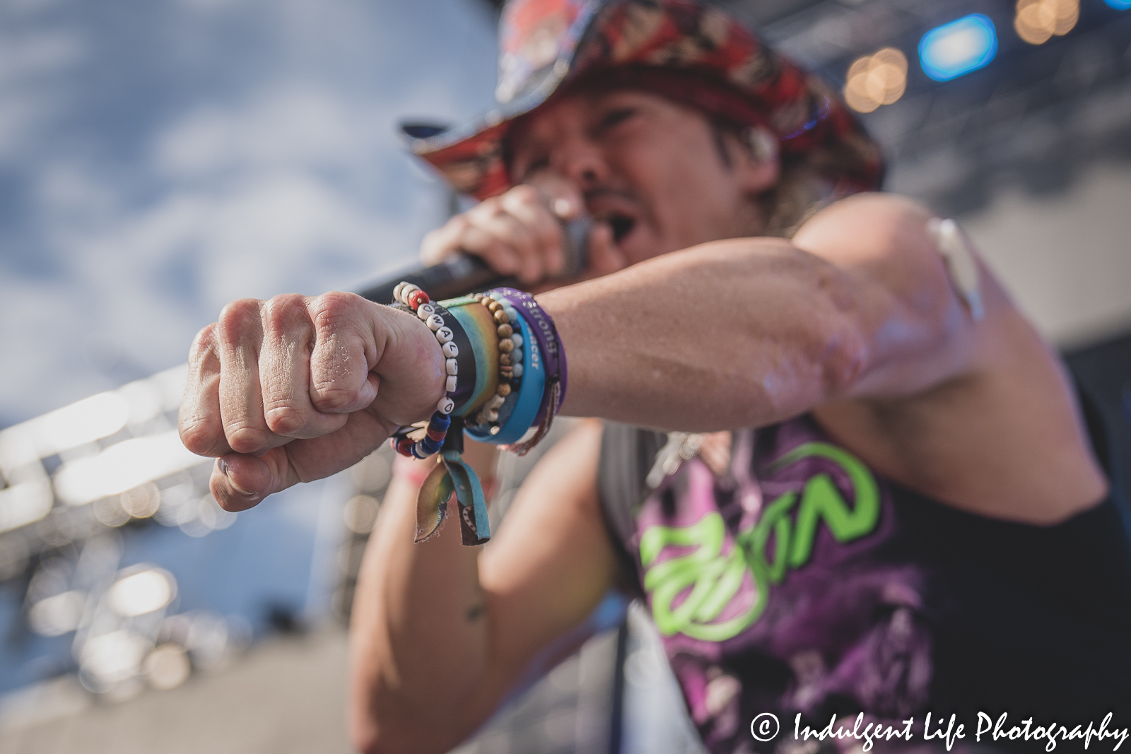 Bret Michaels pounding fists with fans during the Poison concert at Kauffman Stadium in Kansas City, MO on July 19, 2022.