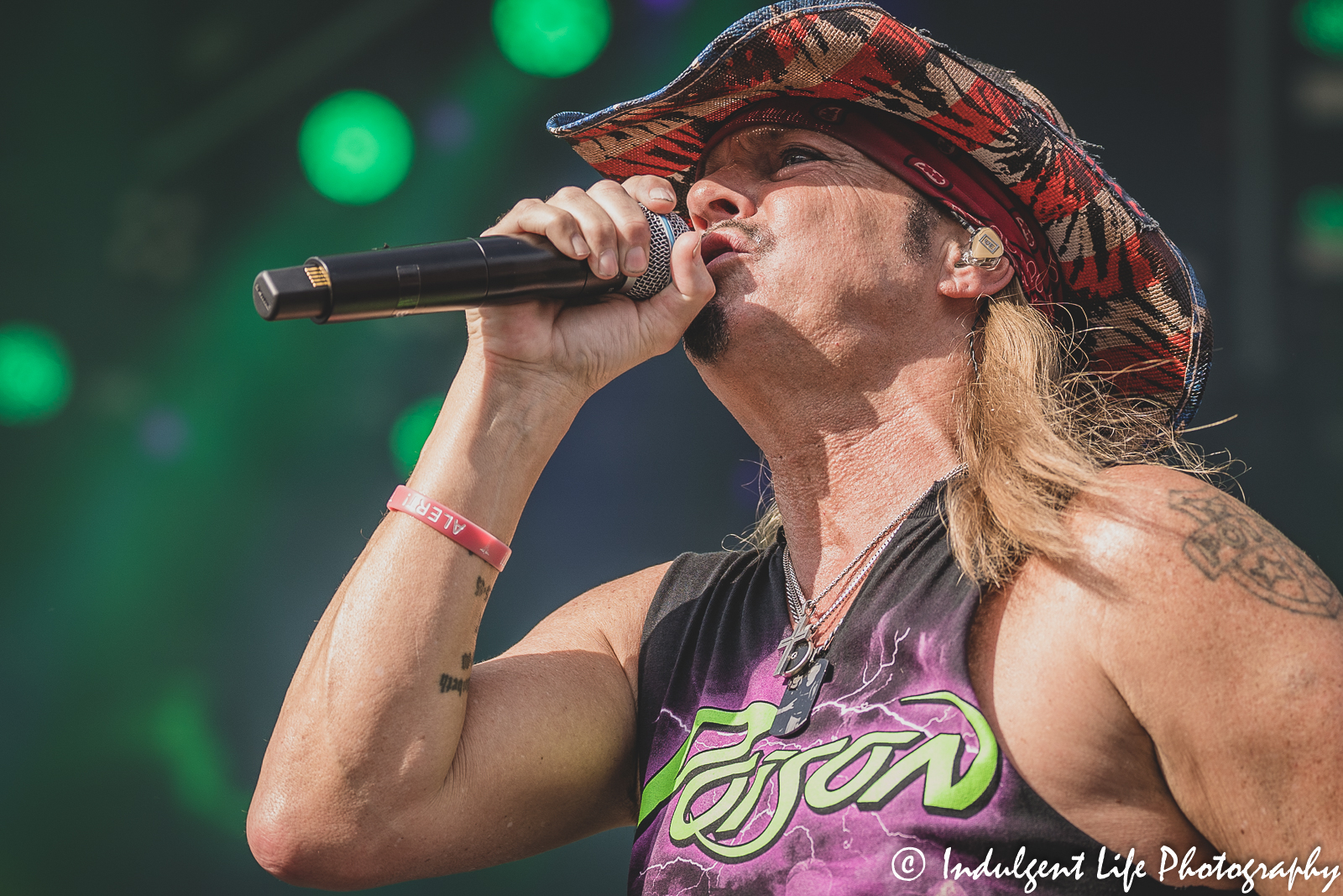 Lead singer Bret Michaels of Poison singing "Look What the Cat Dragged In" during the stadium tour stop at Kauffman Stadium in Kansas City, MO on July 19, 2022.