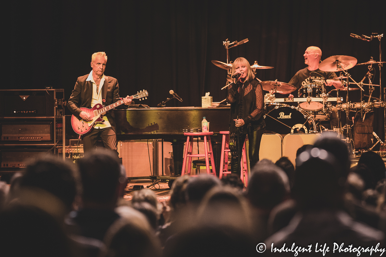 Pat Benatar & Neil Giraldo performing live with drummer Chris Ralles at Uptown Theater in Kansas City, MO on August 2, 2022.