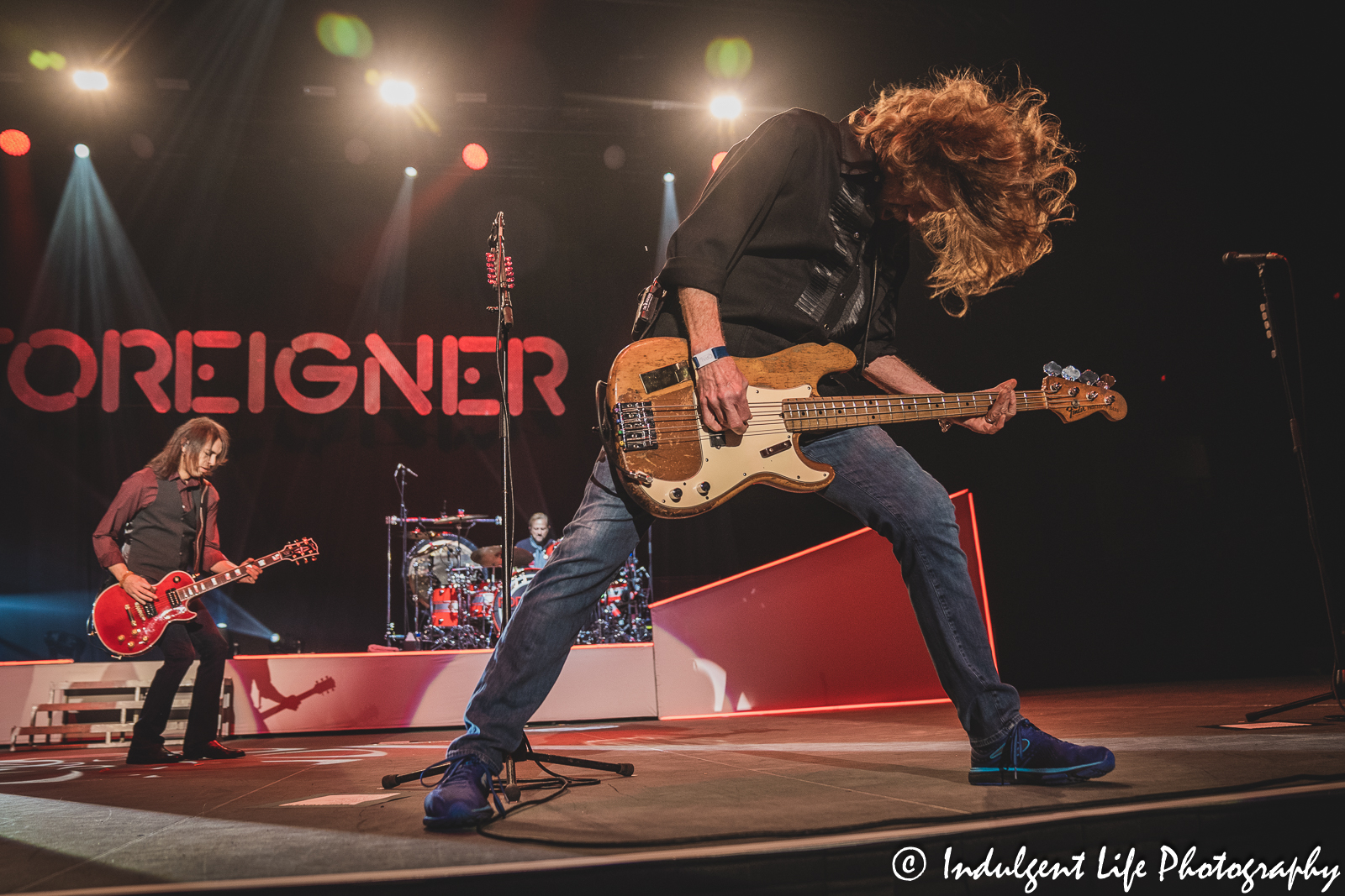 Foreigner bass guitar player Jeff Pilson performing with guitarist Luis Maldonado and drummer Chris Frazier at Hartman Arena in Park City, KS on April 30, 2023.
