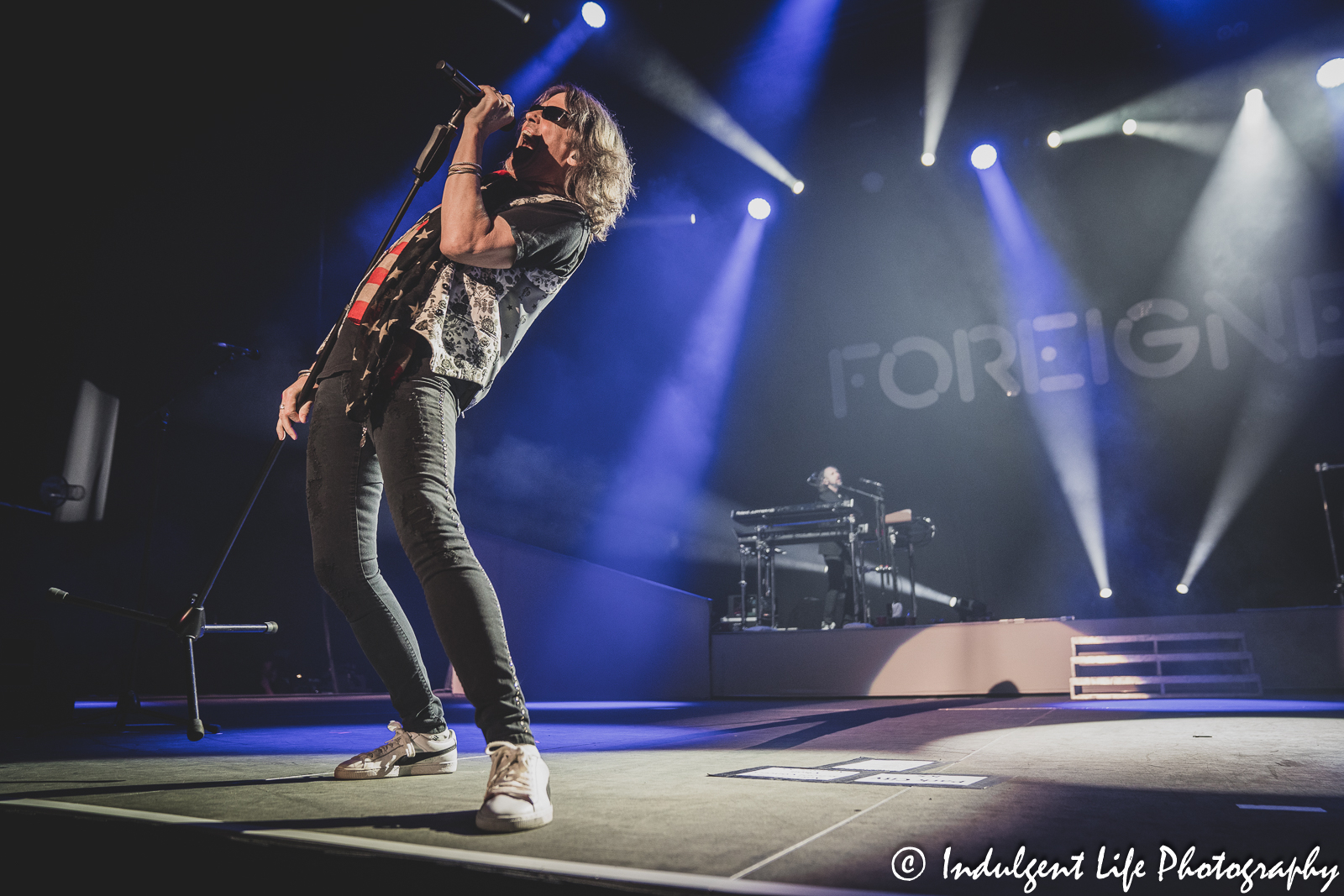 Lead vocalist Kelly Hansen of Foreigner performing "Head Games" with keyboard player Michael Bluestein at Hartman Arena in Park City, KS on April 30, 2023.