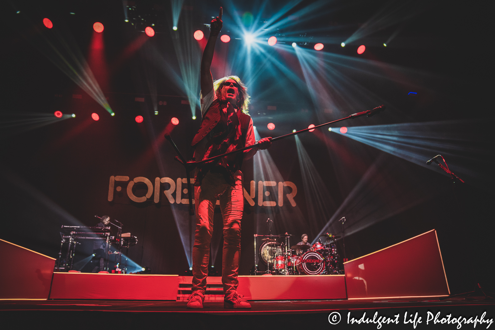 Foreigner lead singer Kelly Hansen performing with keyboard player Michael Bluestein and drummer Chris Frazier at Stormont Vail Events Center in Topeka, KS on May 2, 2023.