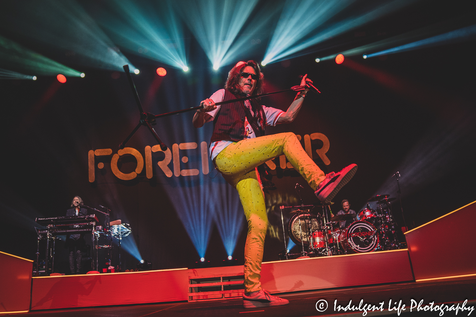 Lead singer Kelly Hansen of Foreigner performing "Double Vision" with keyboardist Michael Bluestein and drummer Chris Frazier at Landon Arena inside of Stormont Vail Events Center in Topeka, KS on May 2, 2023.