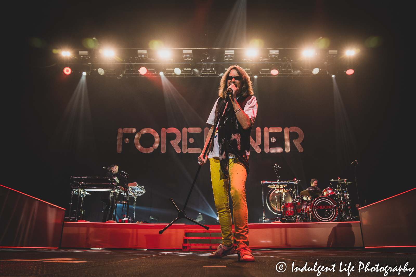 Foreigner frontman Kelly Hansen performing "Double Vision" with keyboard player Michael Bluestein and drummer Chris Frazier at Landon Arena inside of Stormont Vail Events Center in Topeka, KS on May 2, 2023.