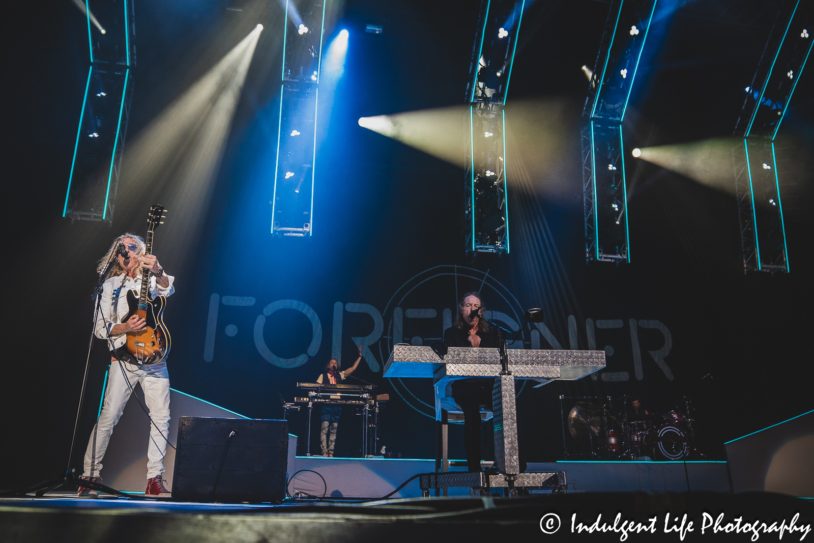 Foreigner band members Bruce Watson, Michael Bluestein, Jeff Pilson and Chris Frazier performing live together at Starlight Theatre in Kansas City, MO on July 18, 2023.