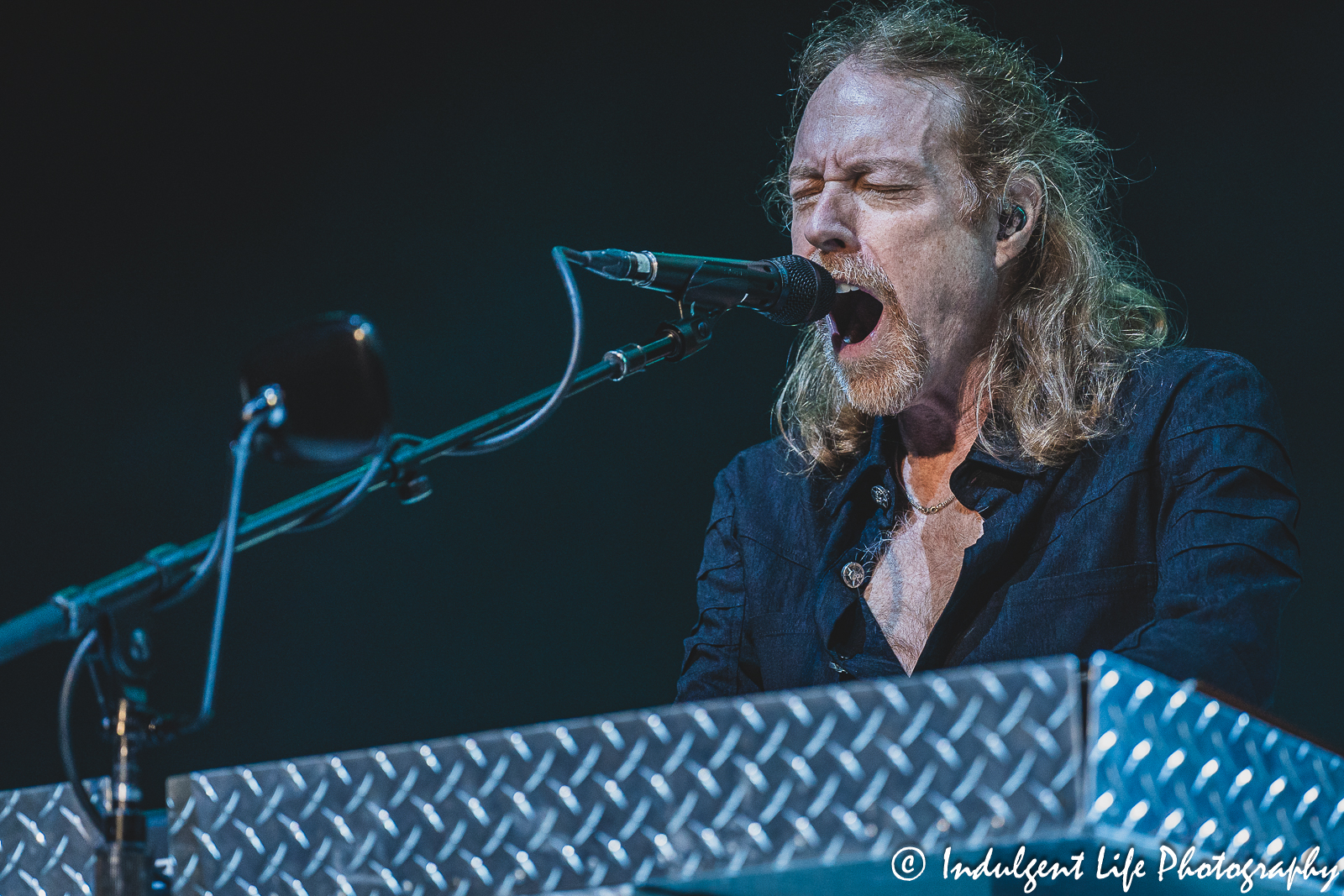 Foreigner's Jeff Pilson playing "Cold as Ice" on the keyboard live during "The Historic Farewell Tour" at Kansas City's Starlight Theatre on July 18, 2023.