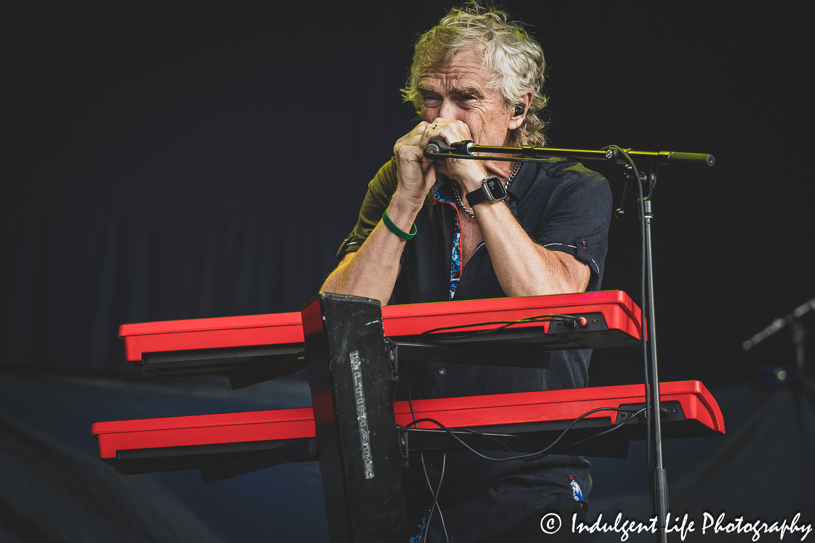 Loverboy keyboard and harmonica player Doug Johnson performing live at Kansas City's Starlight Theatre on July 18, 2023.